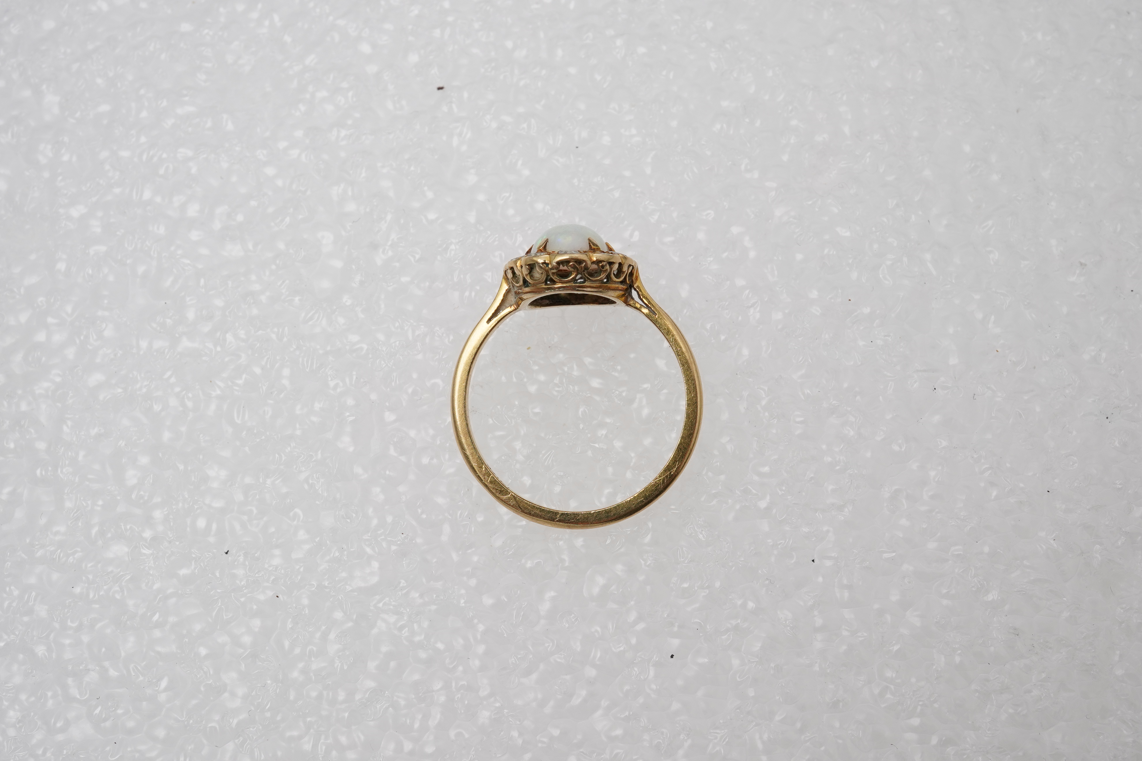 An opal and diamond cluster ring, mid 20th century